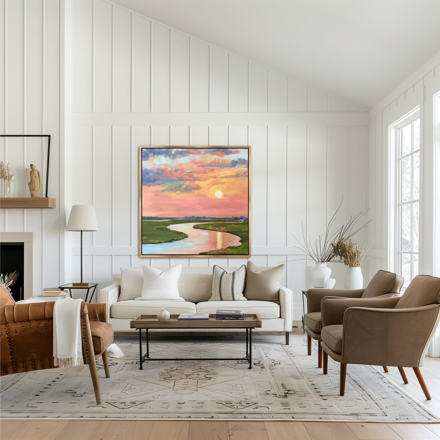 Hand-embellished coastal art featuring melon and periwinkle sunset tones, shown in a gold frame within a bright, transitional family room setting."