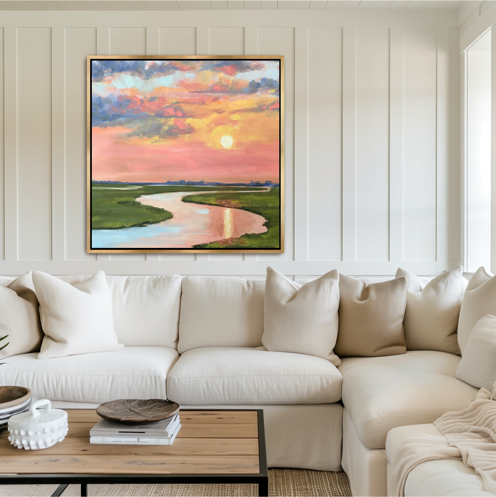 "Large Charleston marsh sunset painting in a gold floater frame, styled as a focal point over a fireplace in a luxury Lowcountry living room.