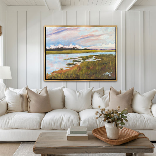 Large square Hilton Head Island marsh painting 'Skull Creek' styled in a gold floater frame, showcasing luminous pink and ocher twilight tones in a sophisticated Southern living room.