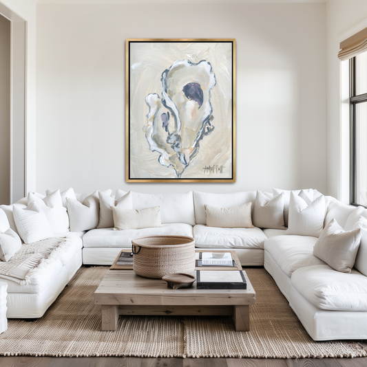 Vertical beige oyster shell art styled as part of a neutral gallery wall in a luxury Hilton Head home, framed in elegant gold.