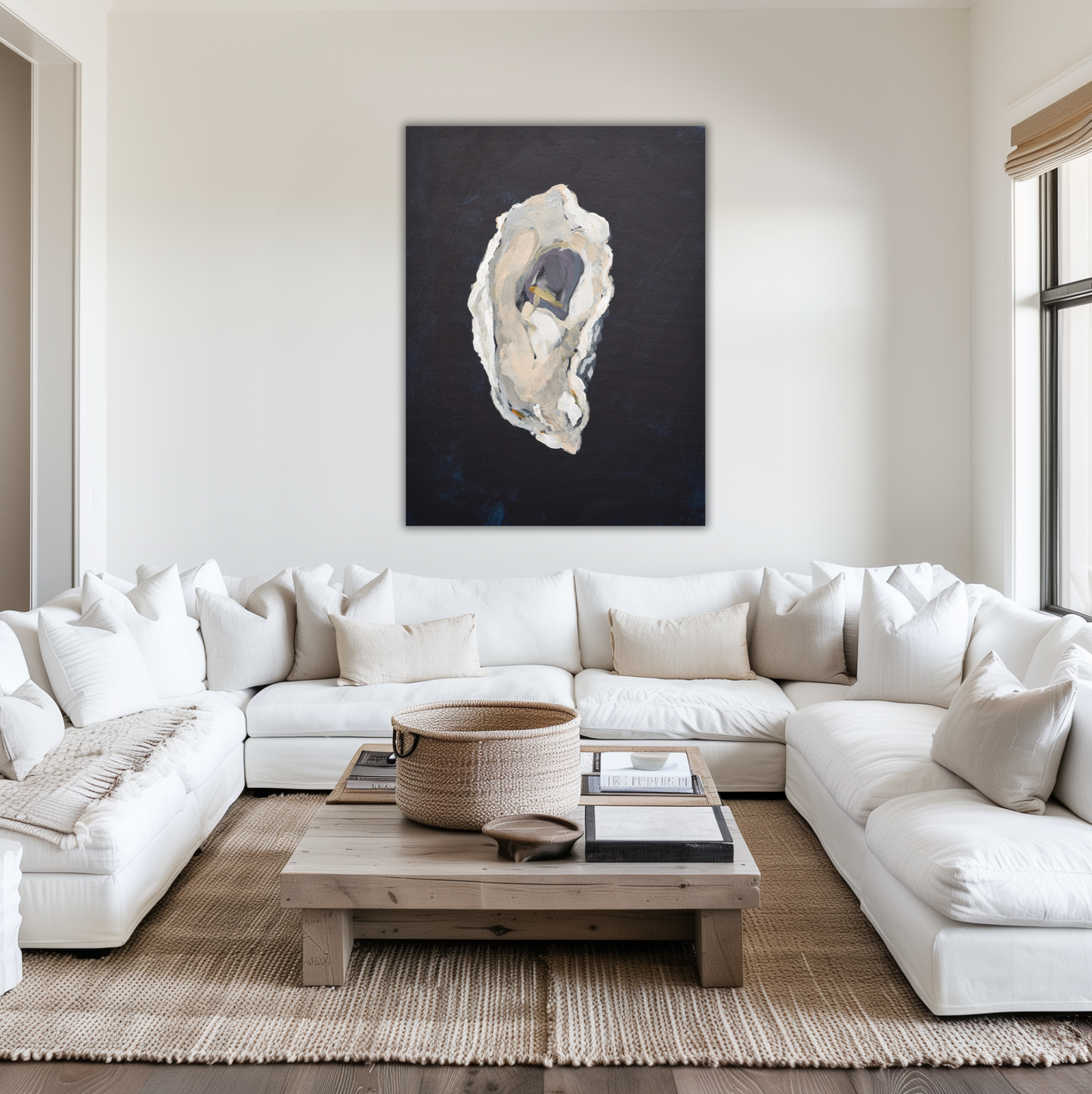 Modern living room with a white sectional sofa, wooden coffee table, and abstract oyster shell art on the wall.