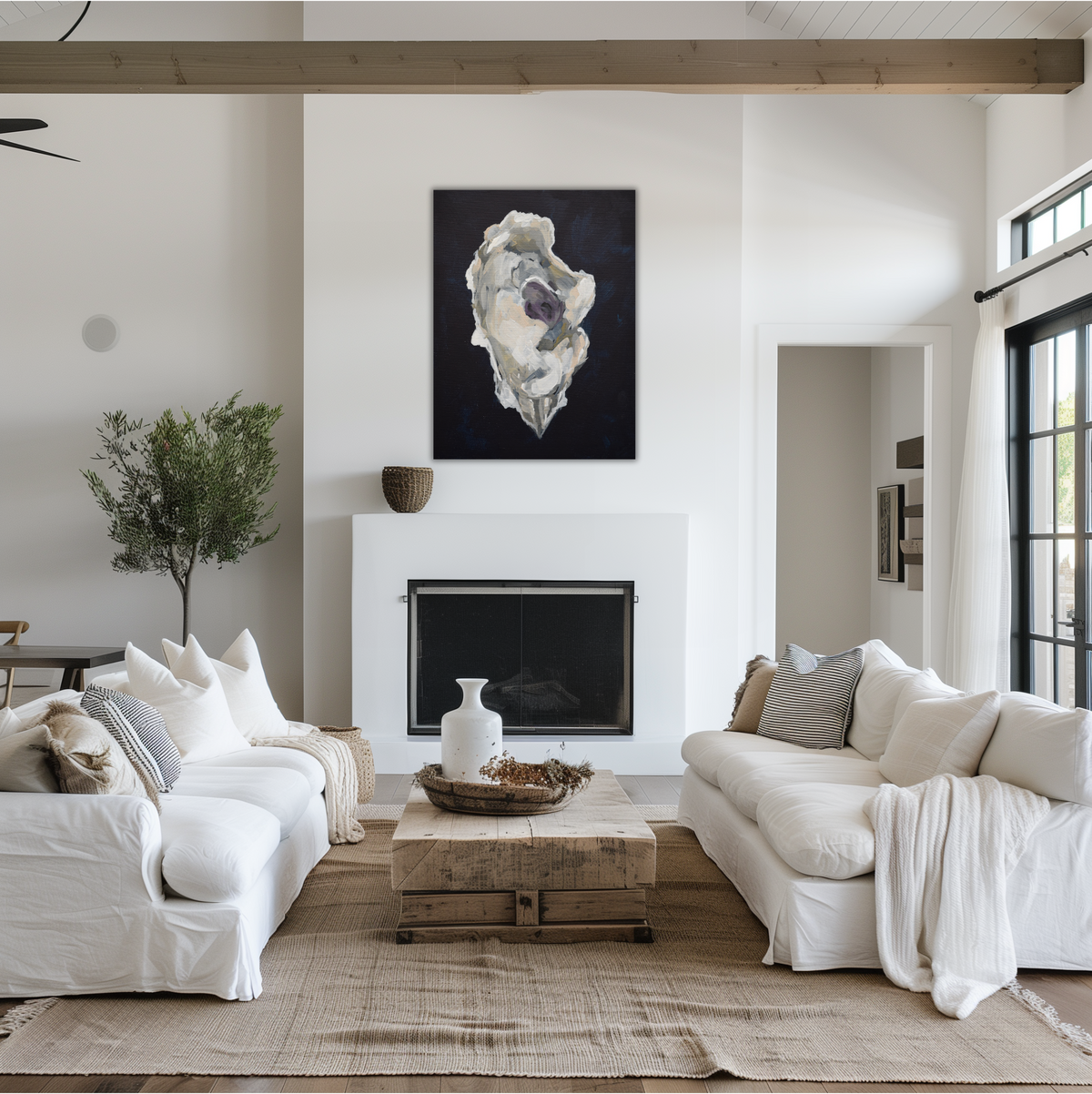 White and gray oyster painting against a a deep Indigo Blue background hung above a mantle in a Modern living room with white sofas, a wooden coffee table, and a fireplace.