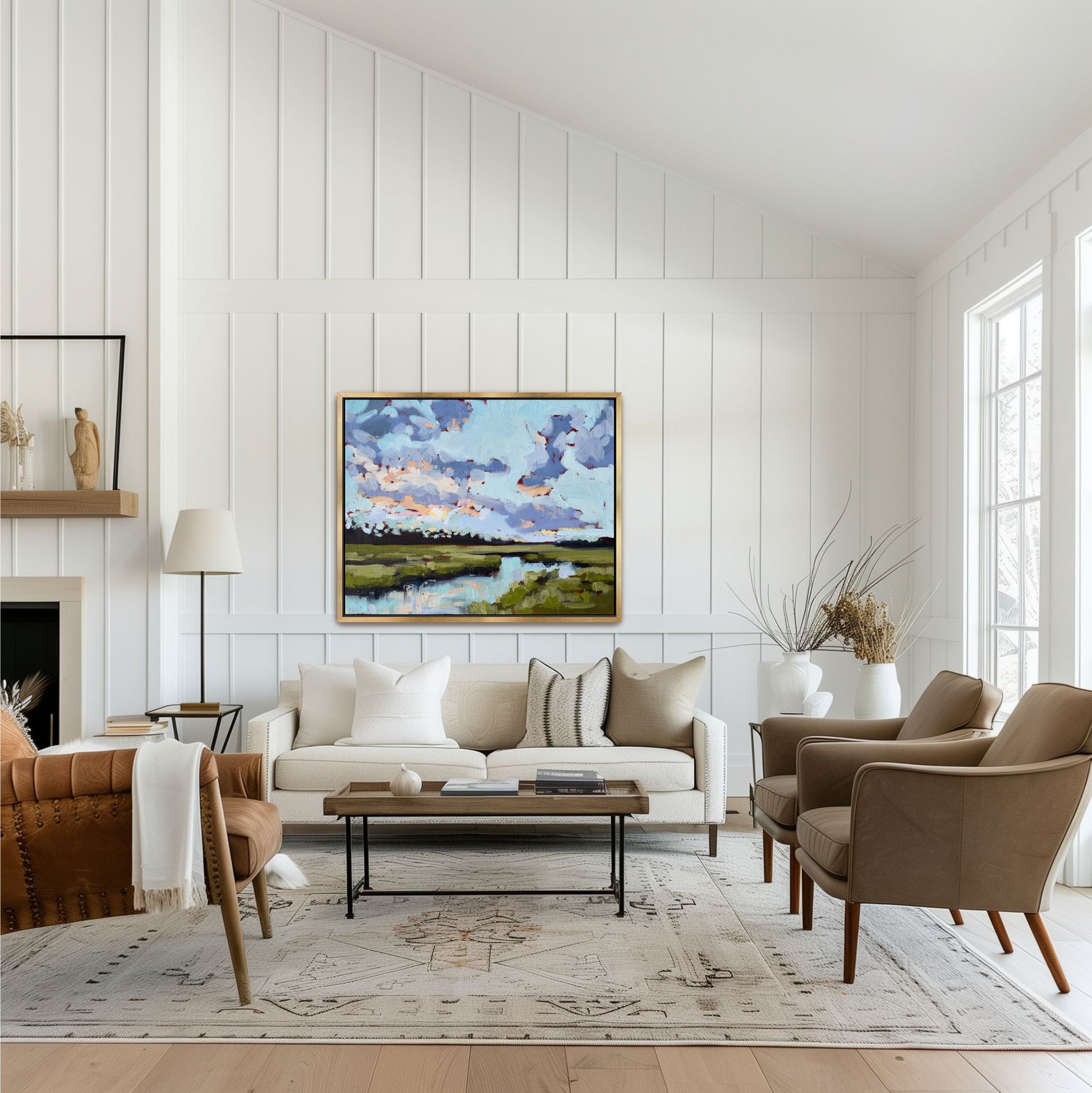 Large wall art of  'Jekyll Island Morning' showing loose impasto brushwork and periwinkle reflections in a gold floater frame, styled above a sofa in a coastal home."