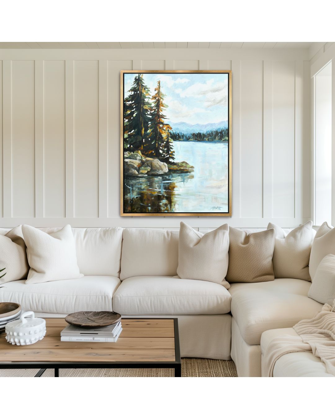 Lake life Mountain Lake painting on canvas in a gold frame hung in a modern lake cottage living room with white sectional.