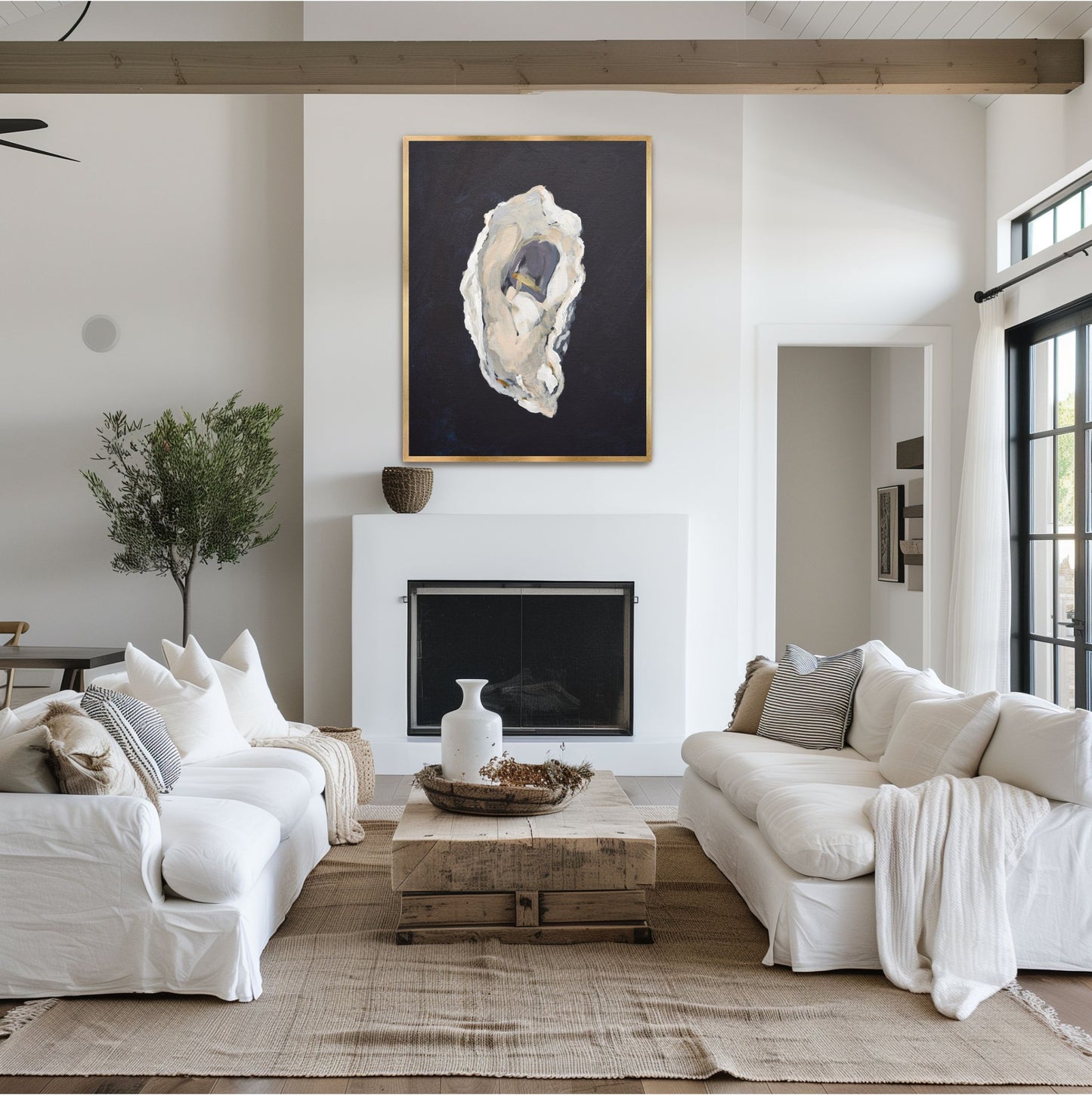 Vertical indigo and grey oyster study 'The Provider' in a designer gold frame, styled as a focal point in a coastal-inspired dining room celebrating Southern maritime heritage.
