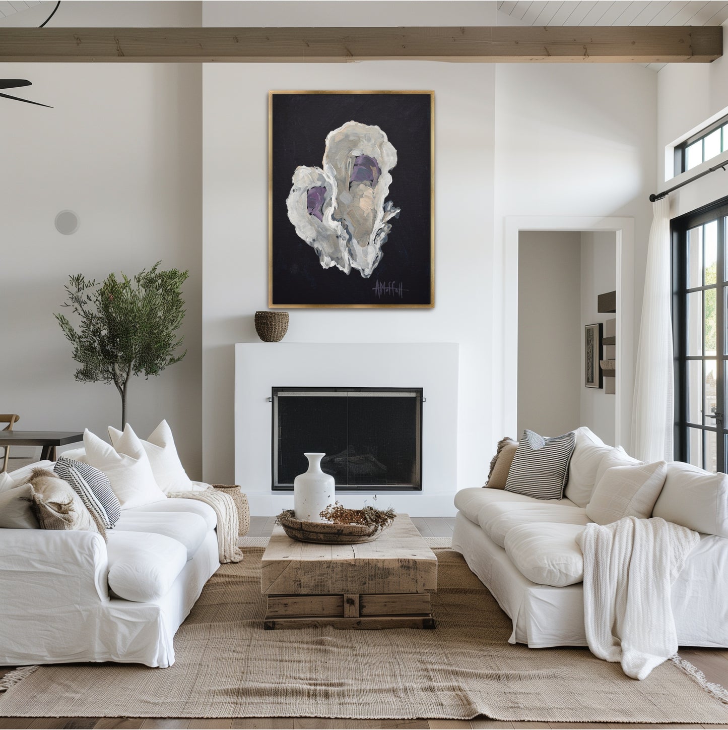 Modern indigo and beige oyster shell art 'Indigo Oyster 2' styled in a gold frame above a sideboard in a sophisticated coastal South Carolina dining room.