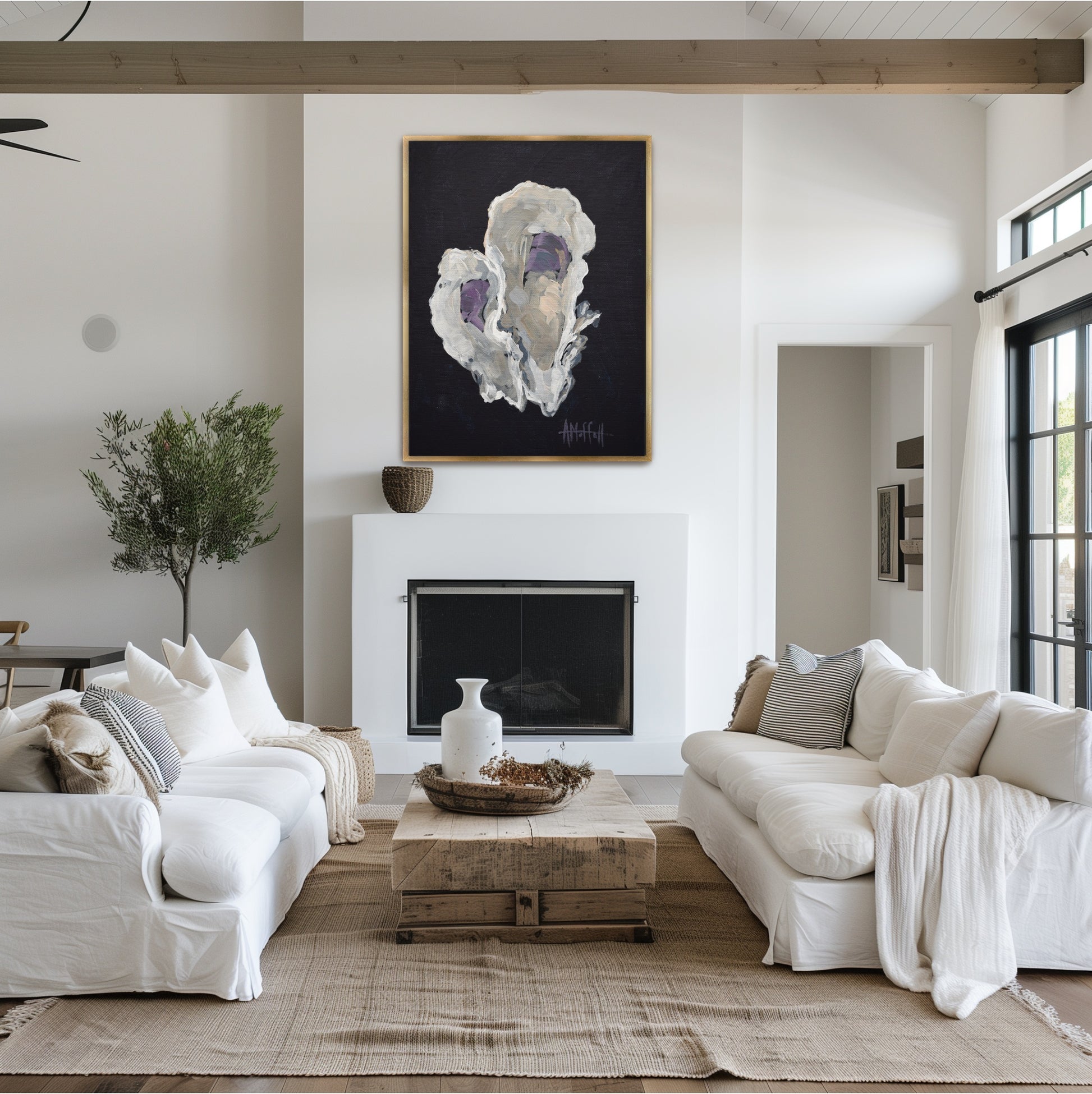 Modern indigo and beige oyster shell art 'Indigo Oyster 2' styled in a gold frame above a sideboard in a sophisticated coastal South Carolina dining room.