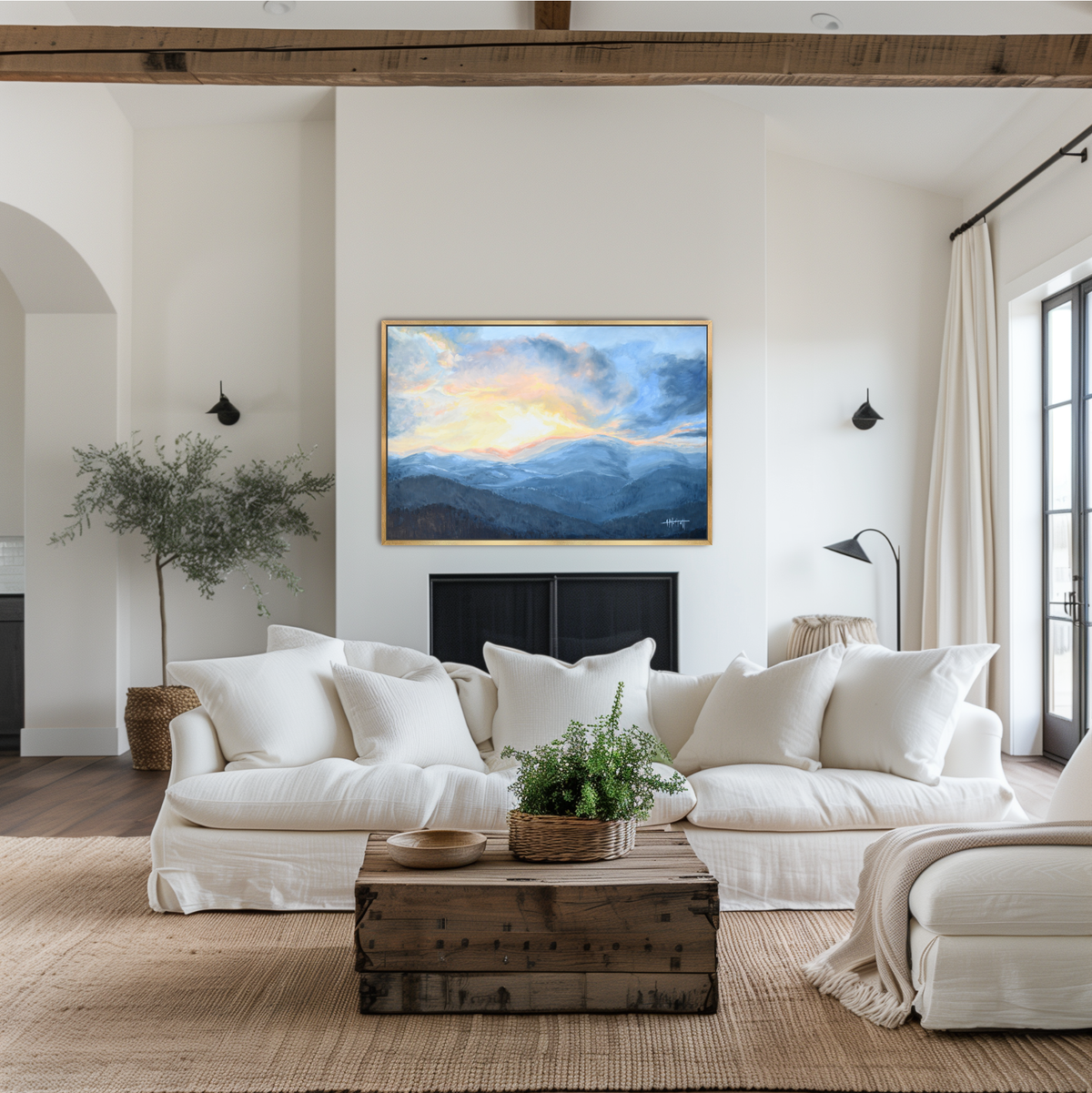 "Framed Sunset Over the Blue Ridge Mountains landscape painting print styled over a stone fireplace mantel in an elegant living room."
